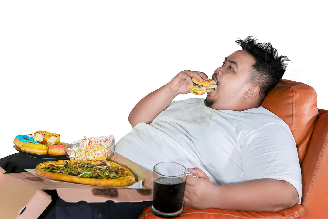 Overweight Man Stuffing Inflammatory Foods