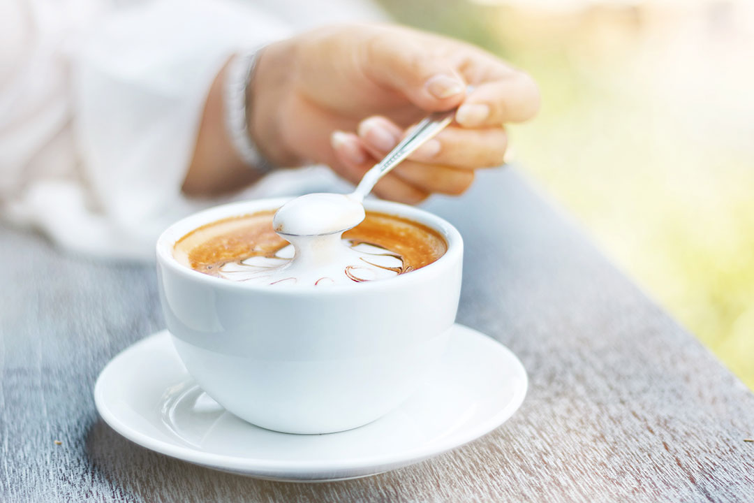Spooning Cream Hot Coffee
